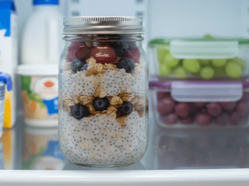 Jar of prepared overnight oats chilling in the refrigerator.