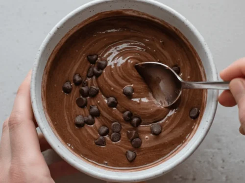 Freshly cooked protein mug cake with a fluffy texture, made in the microwave.